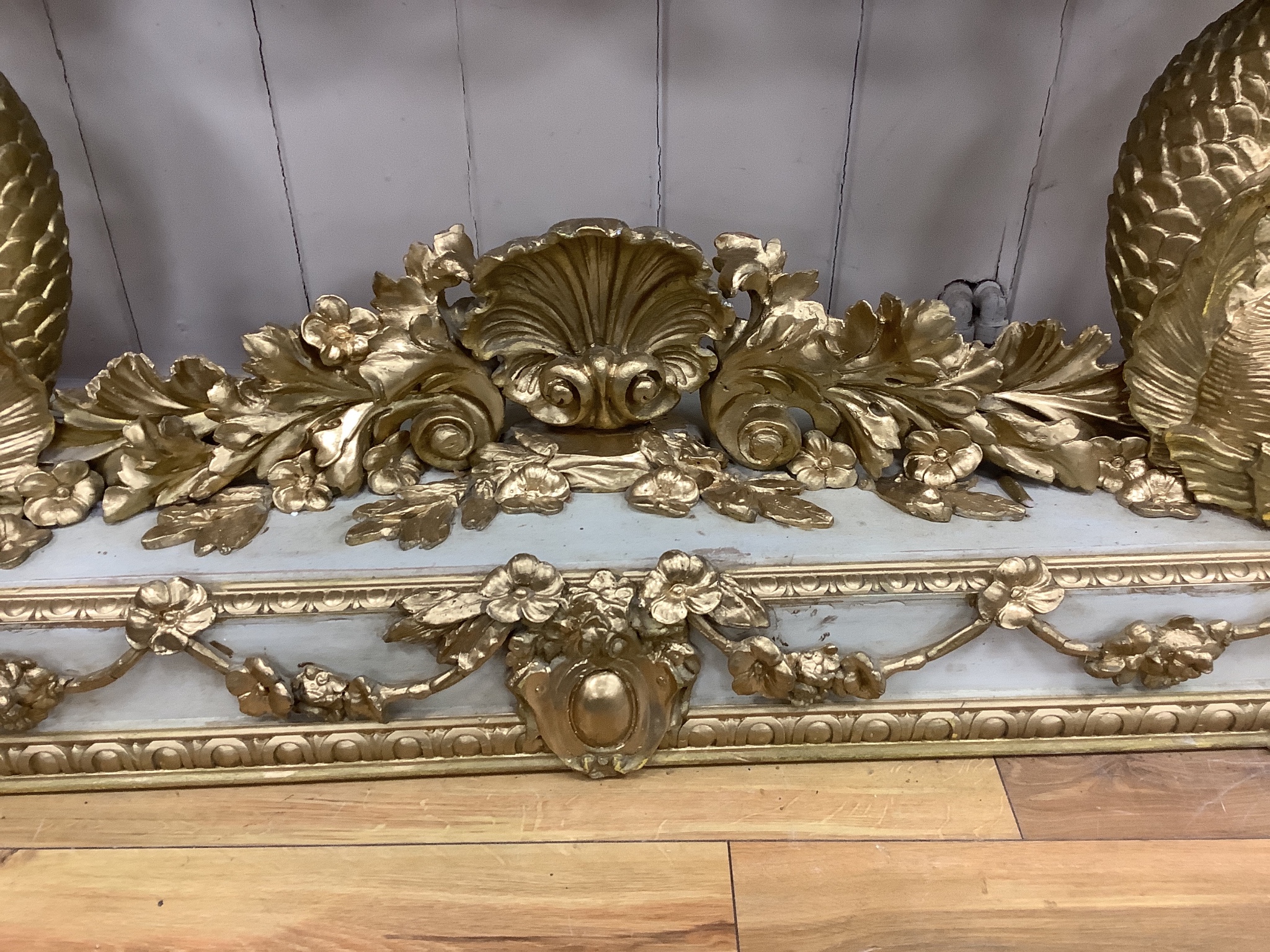 A Louis XVI style painted composition and giltwood console table on dolphin supports, width 146cm, depth 43cm, height 85cm